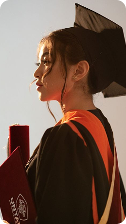 Graduate celebrating in cap and gown